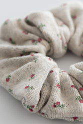 Close-up of berry cream ribbed scrunchie with tiny red floral pattern – Avauma